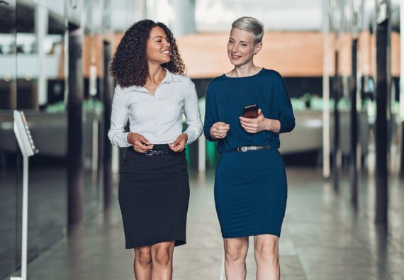 Couple of businesswomen talking in the corridor